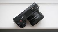 Sony ZV-E10 II digital camera sitting on a white windowsill