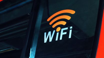 A bus with a WiFi sign on the back