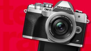 Olympus OM-D E-M10 Mark IV, one of the best camera for beginners, against a red TechRadar background