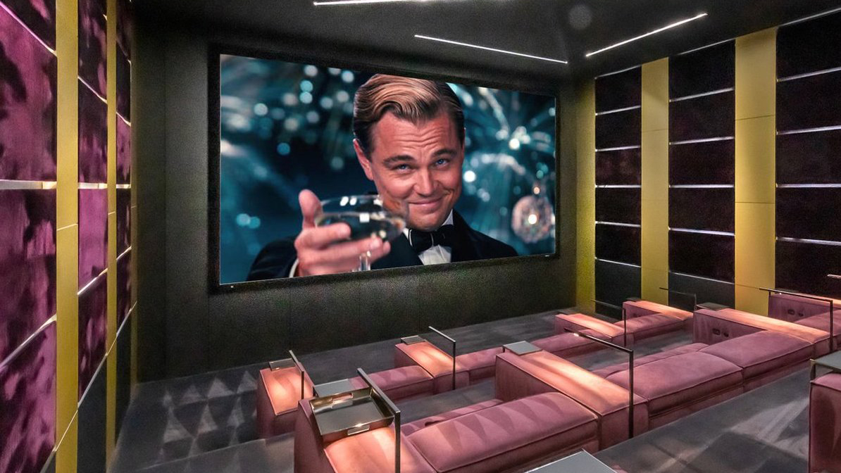 A home theater with elaborate seats and The Great Gatsby on the screen.