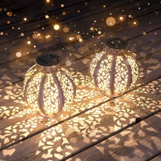 decorative sphere lanterns on wooden flooring