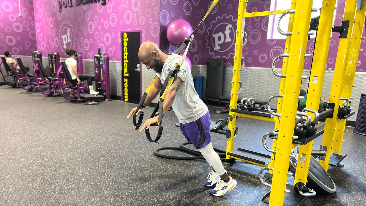 Teddy Savage performing a TRX chest press