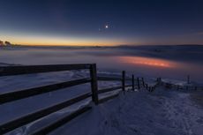 Venus and Jupiter hang over a frozen United Kingdom during a previous apparent conjunction of planets.