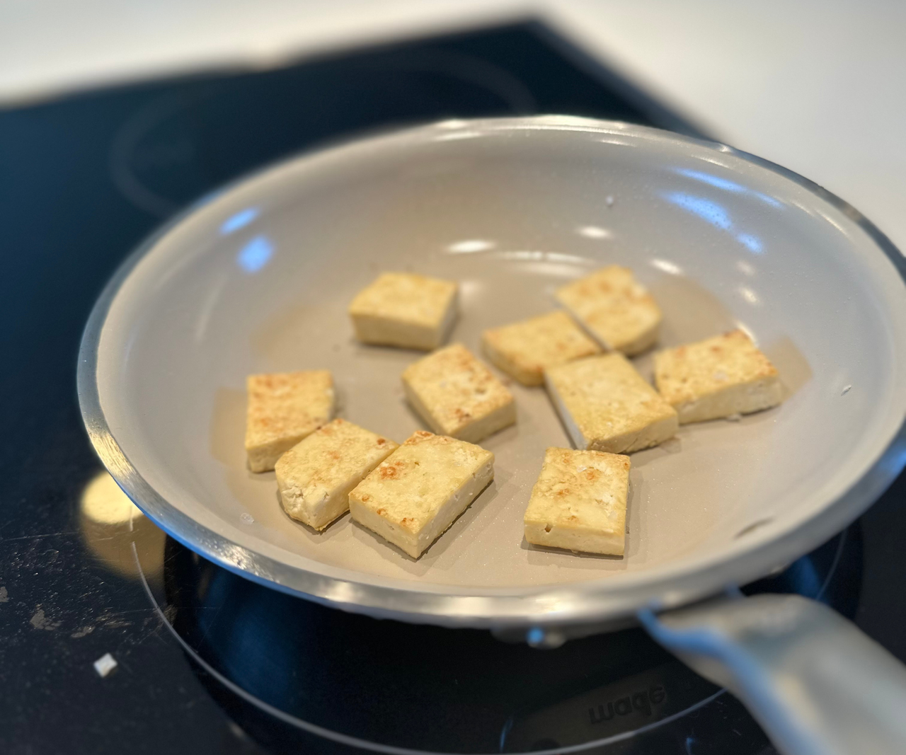 Frying tofu in the Made In CeramiClad&trade; Non-Stick Frying Pan