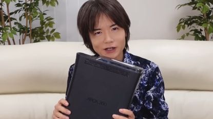 Masahiro Sakurai with his bricked Xbox 360