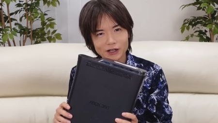 Masahiro Sakurai with his bricked Xbox 360