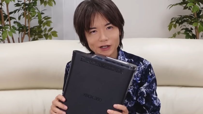 Masahiro Sakurai with his bricked Xbox 360