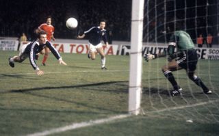 Portugal goalkeeper Manuel Bento saves a header from Scotland's Kenny Dalglish in 1980.