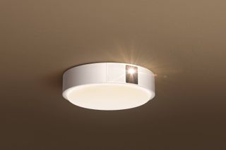 XGIMI Magic Lamp. A round ceiling lamp with a projector on the side of it.