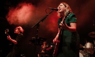 Carrie Brownstein (left) and Corin Tucker of the American band Sleater-Kinney perform live on stage during a concert at the Kesselhaus on August 17, 2024 in Berlin, Germany.