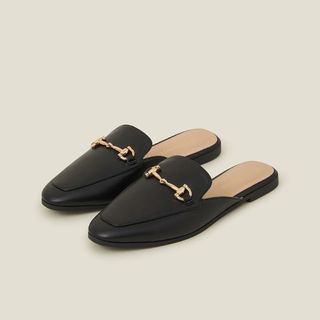 Flat lay image of black loafers