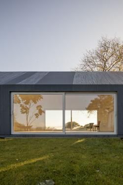 Ground floor house in grey coloured and glass window