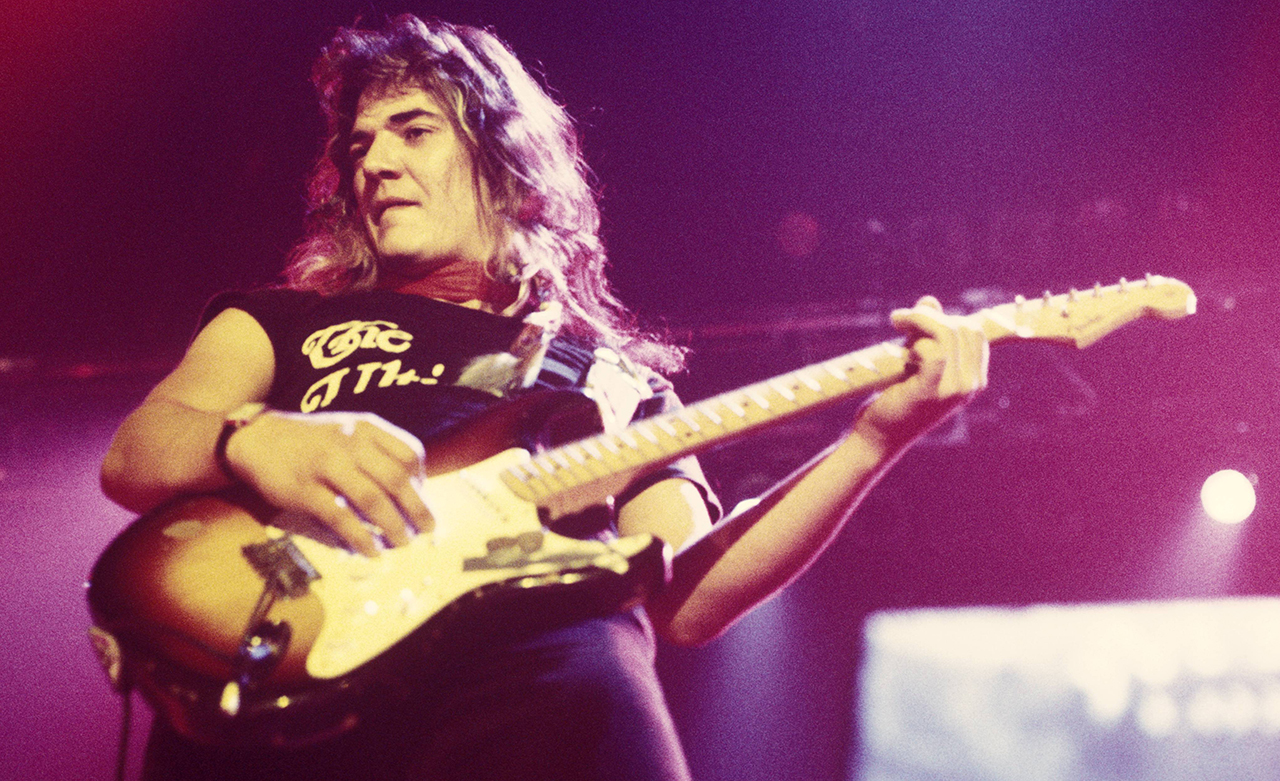 Tommy Bolin performing live onstage, playing Fender Stratocaster guitar