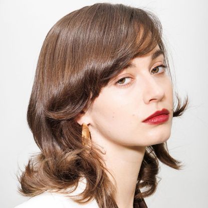 best long lasting lipstick - model backstage with red lips