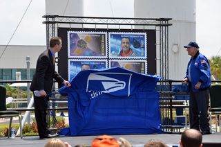 U.S. Postal Service Vice President Stephen Masse, left, and Mercury astronaut Scott Carpenter, right, unveil new stamps honoring first American in space Alan Shepard and NASA’s MESSENGER spacecraft. 