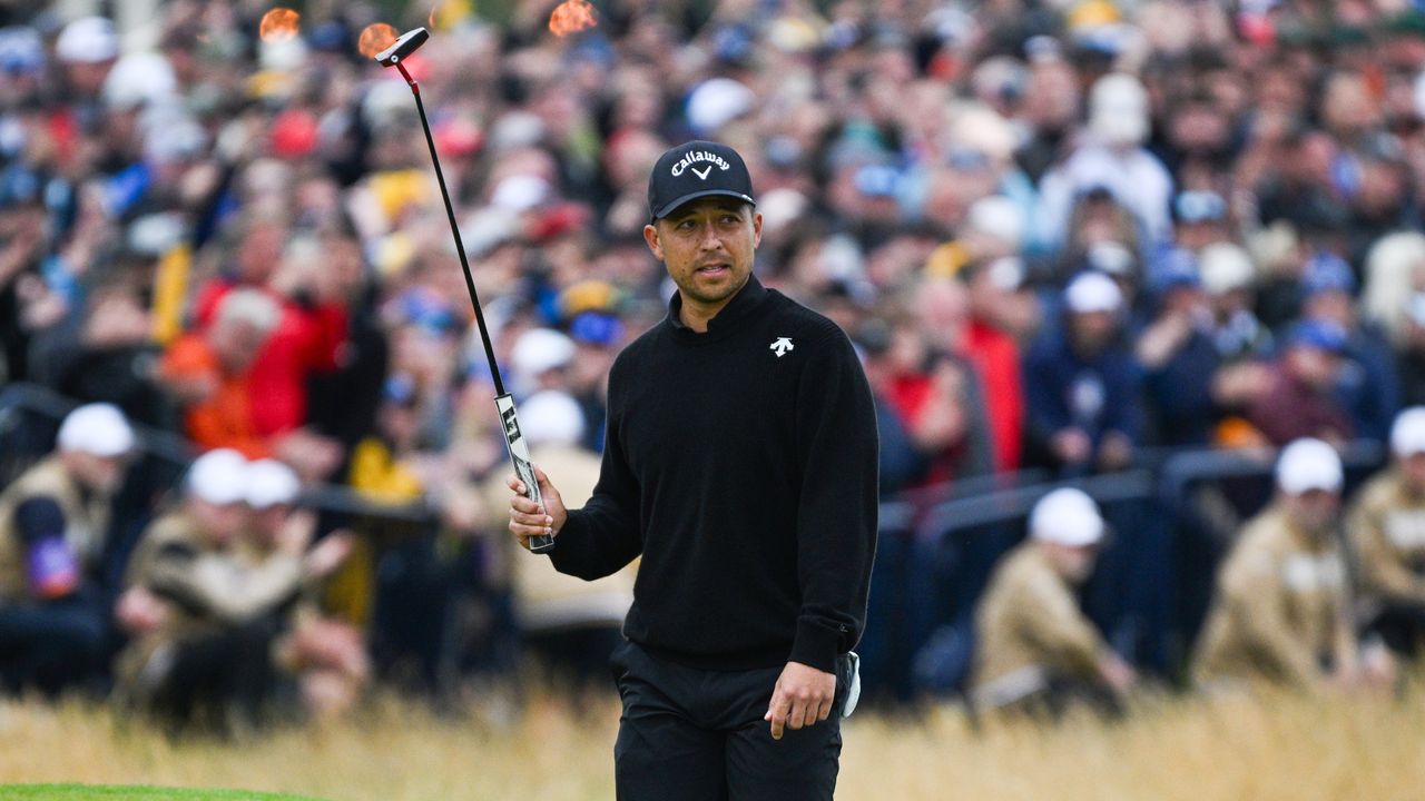 Xander Schauffele acknowledges the fans on the 18th green at The Open