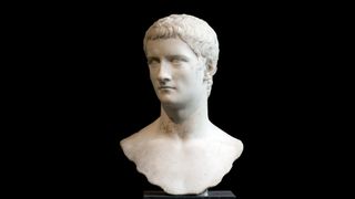 Marble portrait bust of the emperor Gaius, known as Caligula. His head is looking off slightly to the side. He has short, slightly wavy hair.