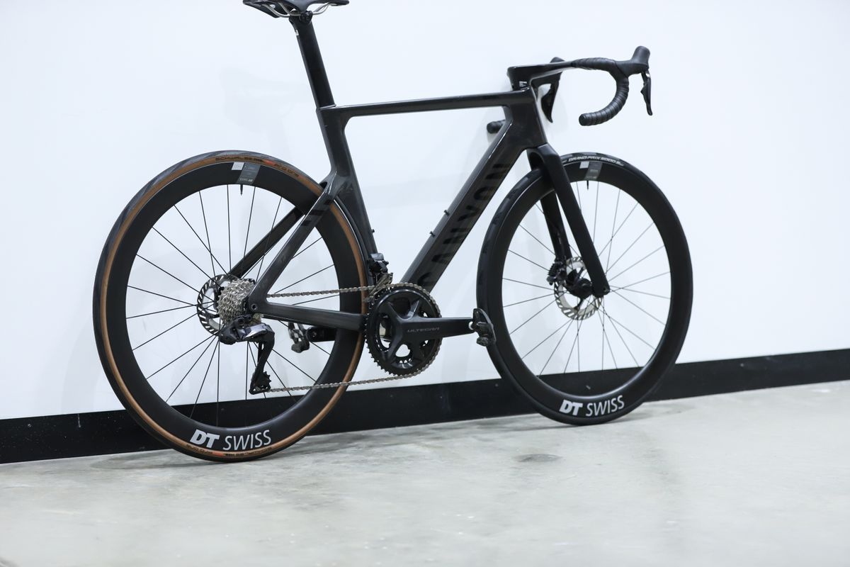 A Black Canyon Aeroad CFR stands against a white wall
