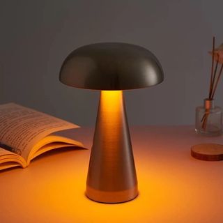 A gold-hued mushroom lamp.