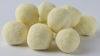 some lemon bon bons on a white background