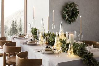 Christmas table centerpiece with garland and mini trees