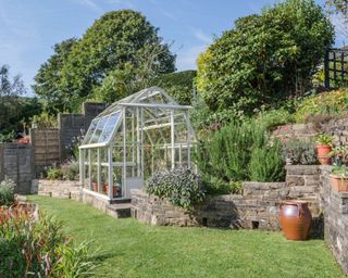 greenhouse in a sloping garden