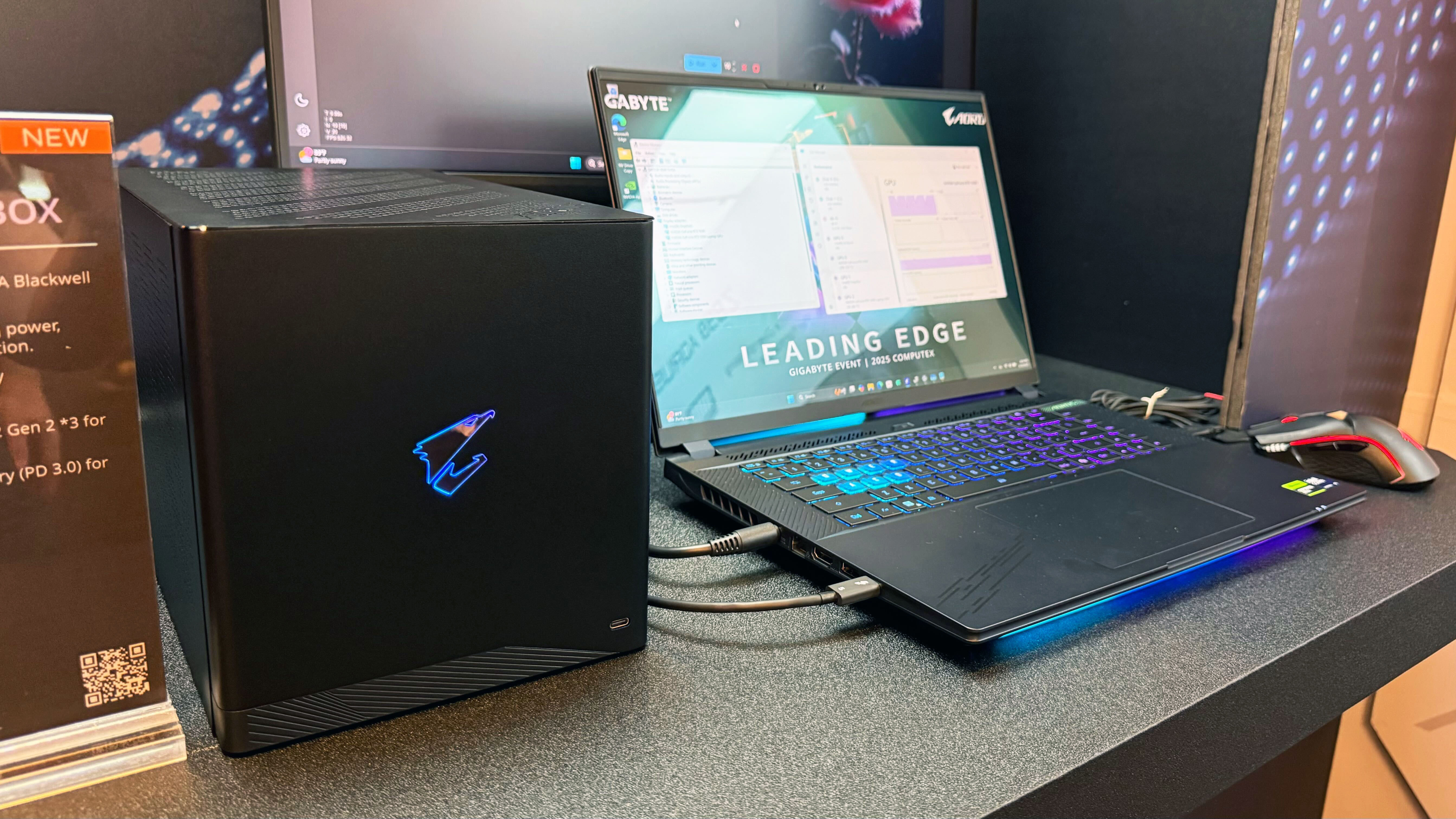 The Gigabyte Aorus RTX 5090 AI Box connected to a laptop, showing its robust GPU power at Computex in Taipei.