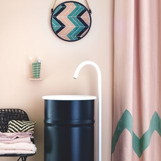 bathroom with pink wall and curtain