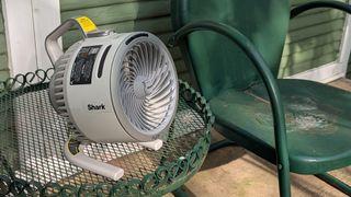 Shark FlexBreeze HydroGo portable fan in a garden