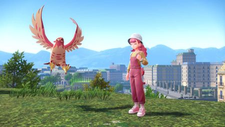 A shiny Talonflame next to a pink-haired trainer in Pokemon Legends: Z-A.