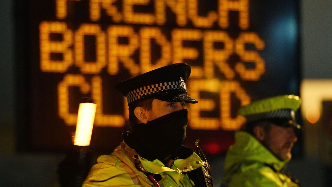 Police officers block access to the port in Dover