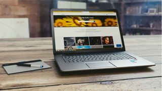 laptop on table displaying website