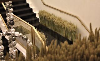 Sheaves of wheat lining the second floor staircase at Chanel’s New Bond Street boutique in London