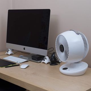Meaco Fan 650 on top of wooden desk next to Apple computer
