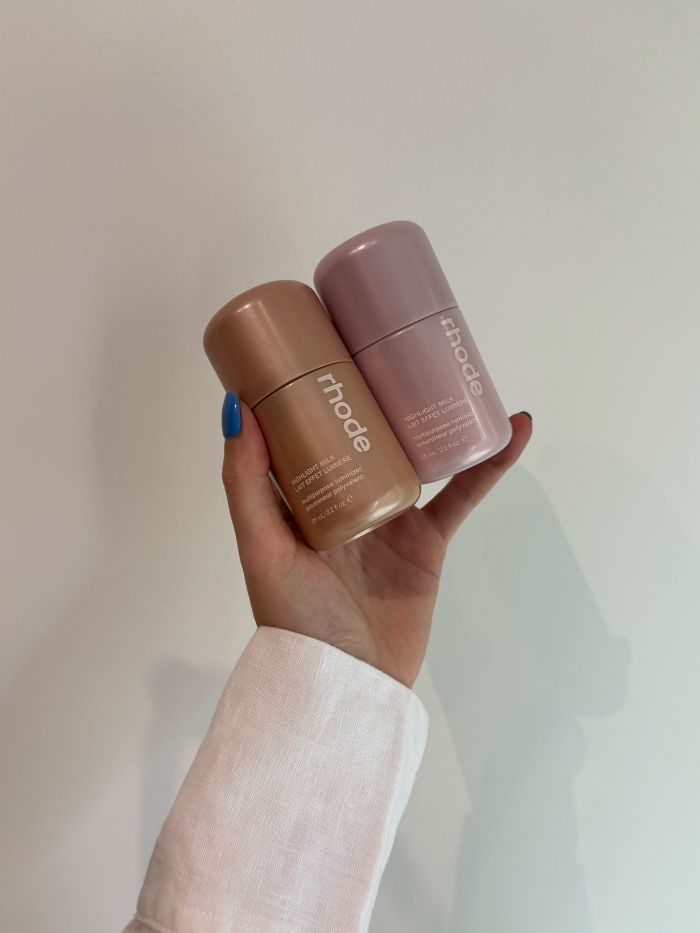 Deputy beauty editor Grace Lindsay holding the Rhode Highlight Milk