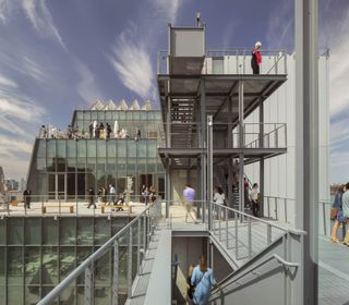 Outside view of Whitney Museum showing glass windows and staircases
