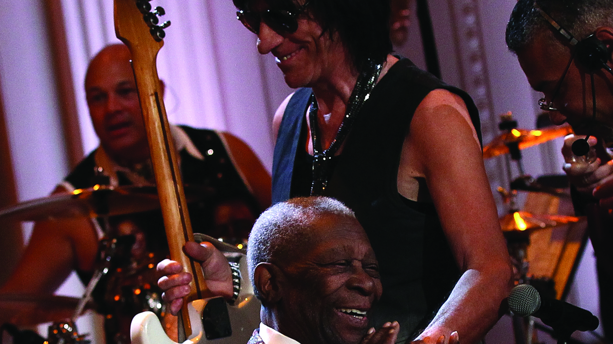 Jeff Beck and BB King smiling onstage at a concert.