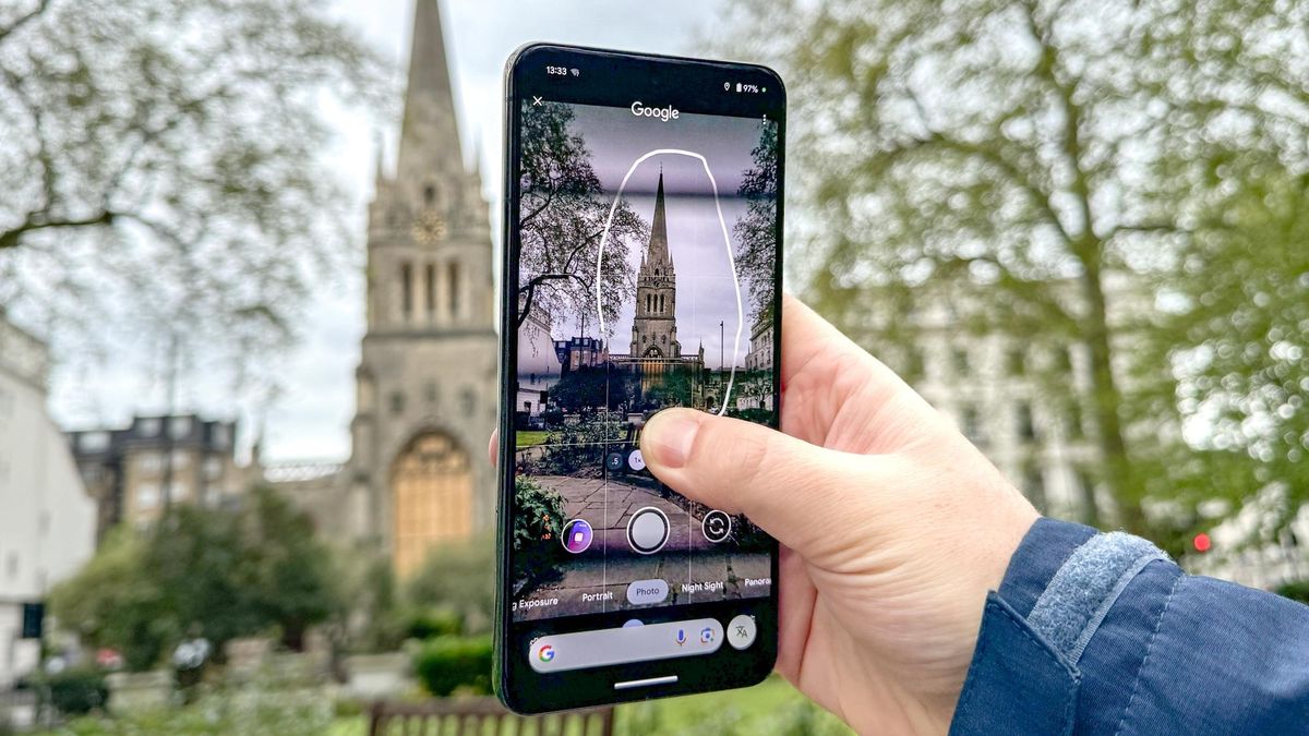 Circle to Search being used on a Google Pixel 8 Pro to look up information on a church via the Camera app viewfinder