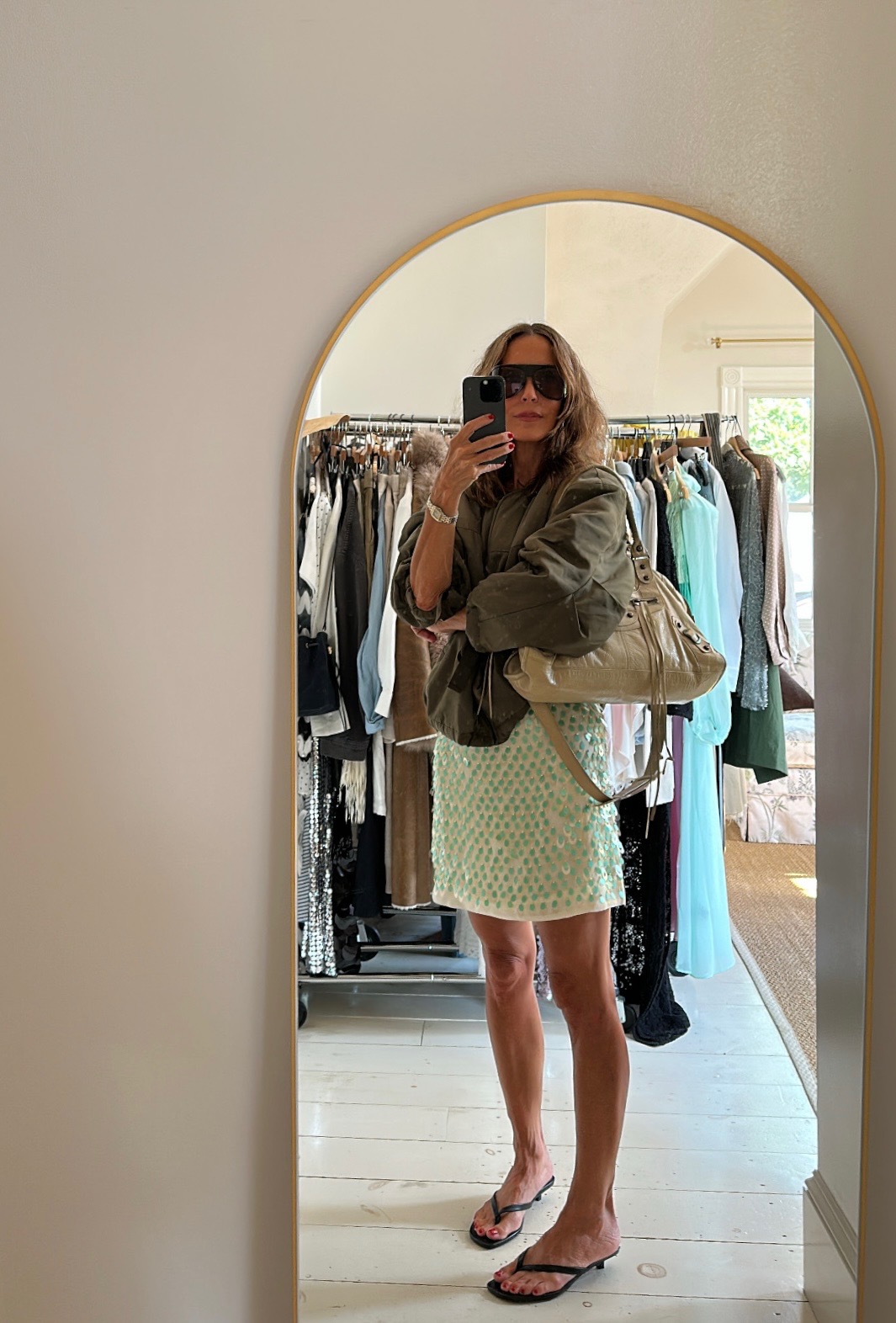 a photo of fashion content creator Larissa Mills wearing trendy shoes and glasses
