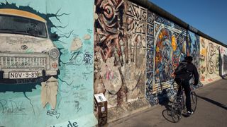 The last remaining 1.3 km of The Berlin Wall runs along Muhlenstrasse parallel to the Spree river and is covered in murals