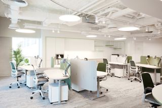 Office interior with traditional office furniture in green and grey