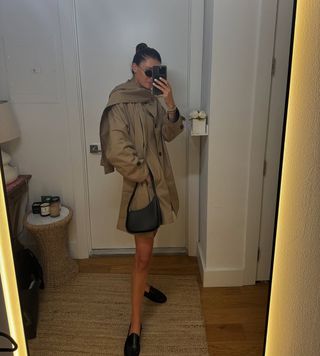 woman wearing trench coat dress and loafers spring outfit