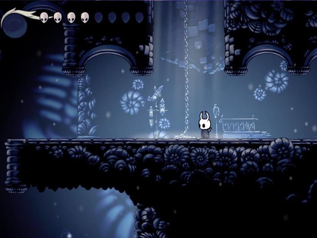a screenshot from hollow knight, showing the Knight standing in a corridor with a chain leading upwards