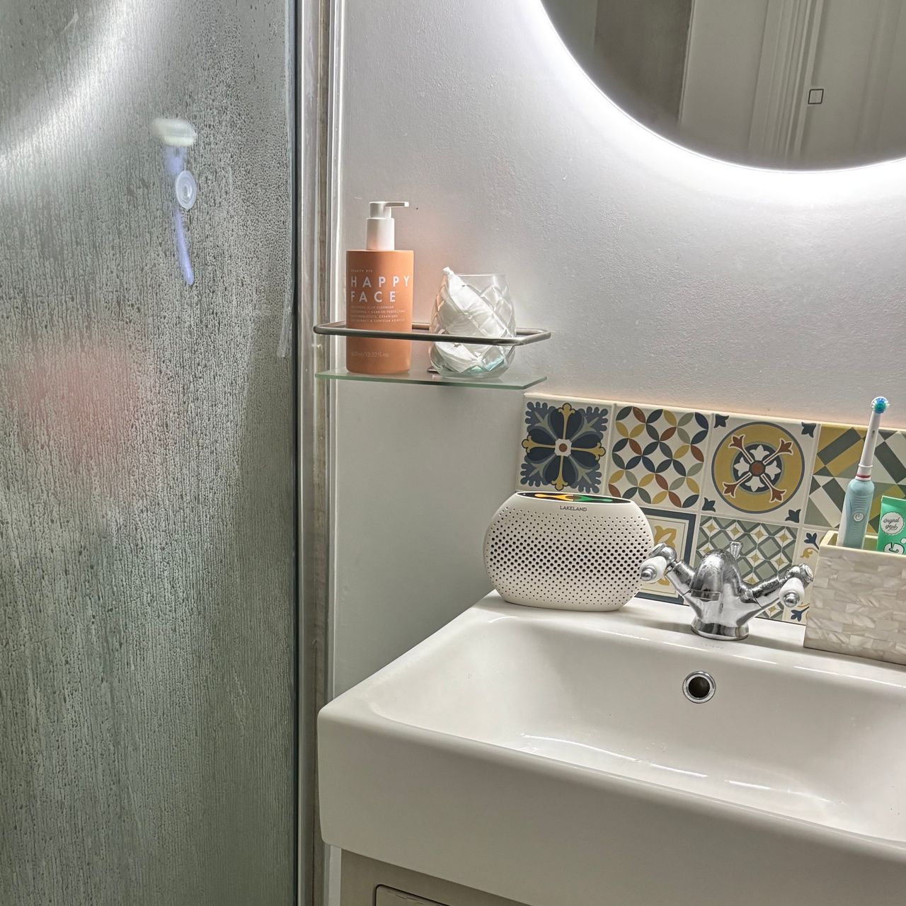 The lakeland small dehumidifier in a bathroom with condensation on shower glass