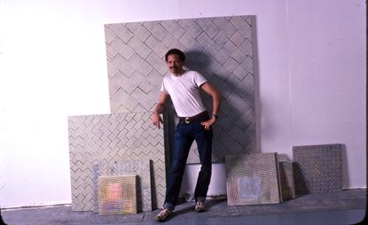 Archive photo of Jack Whitten posing beside artworks