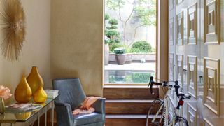 Blue chair, bike, yellow vases