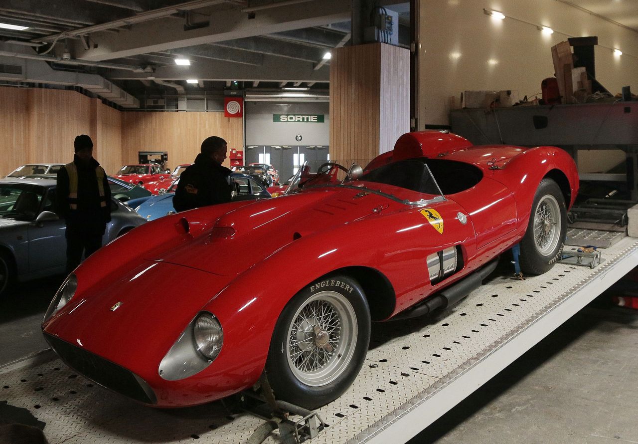 A photo shows a 1957 Ferrari 335S Spider Scaglietti car valued at more than 32 millions of euros on February 2, 2016 in Paris, ahead of a sports car auction scheduled on February 5./ AFP / JA