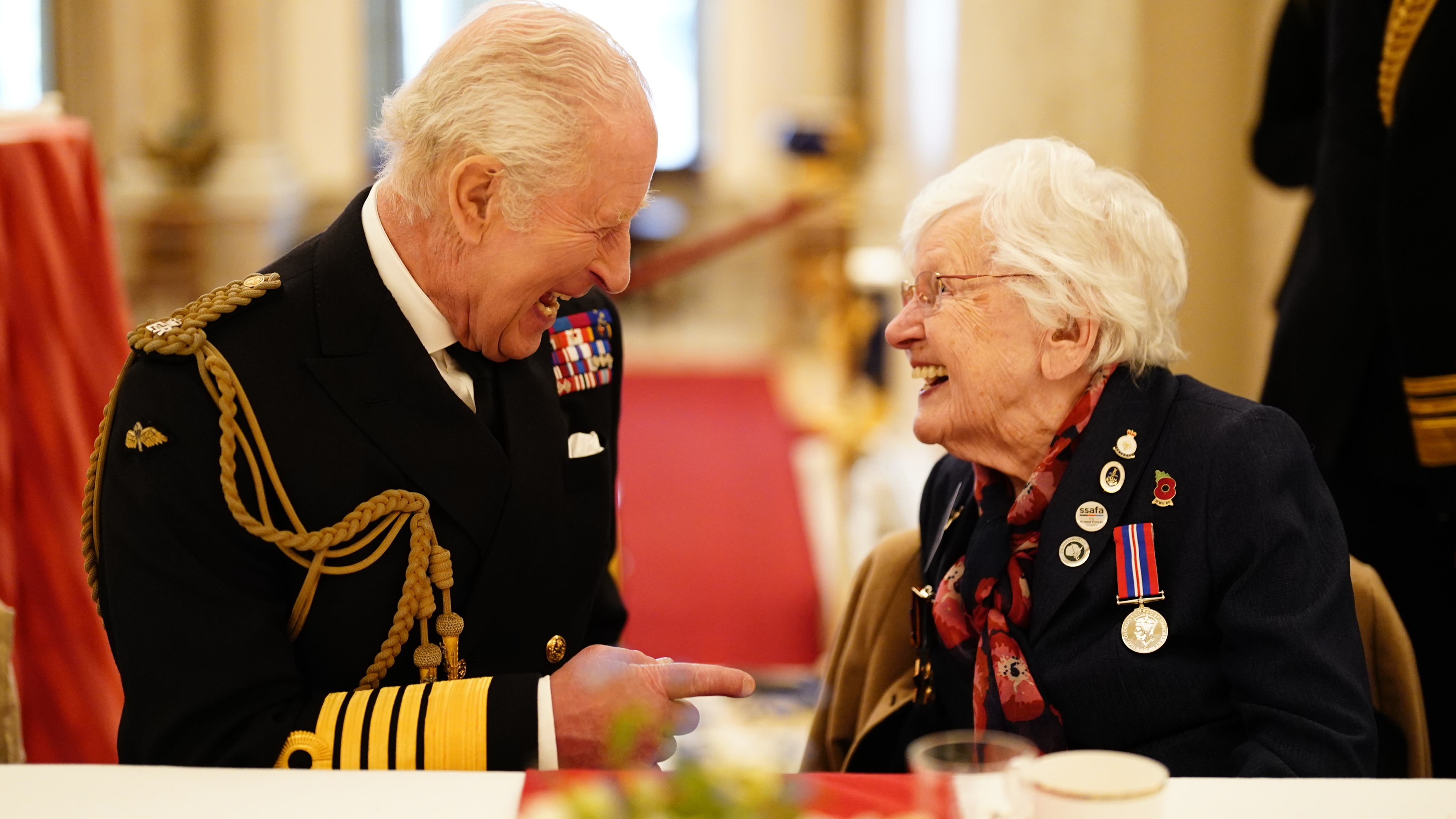 King Charles III joins Second World War veterans at a tea party in Buckingham Palace following the military procession to mark the 80th anniversary of VE Day on May 5, 2025