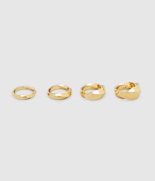 Line of gold rings against a grey background