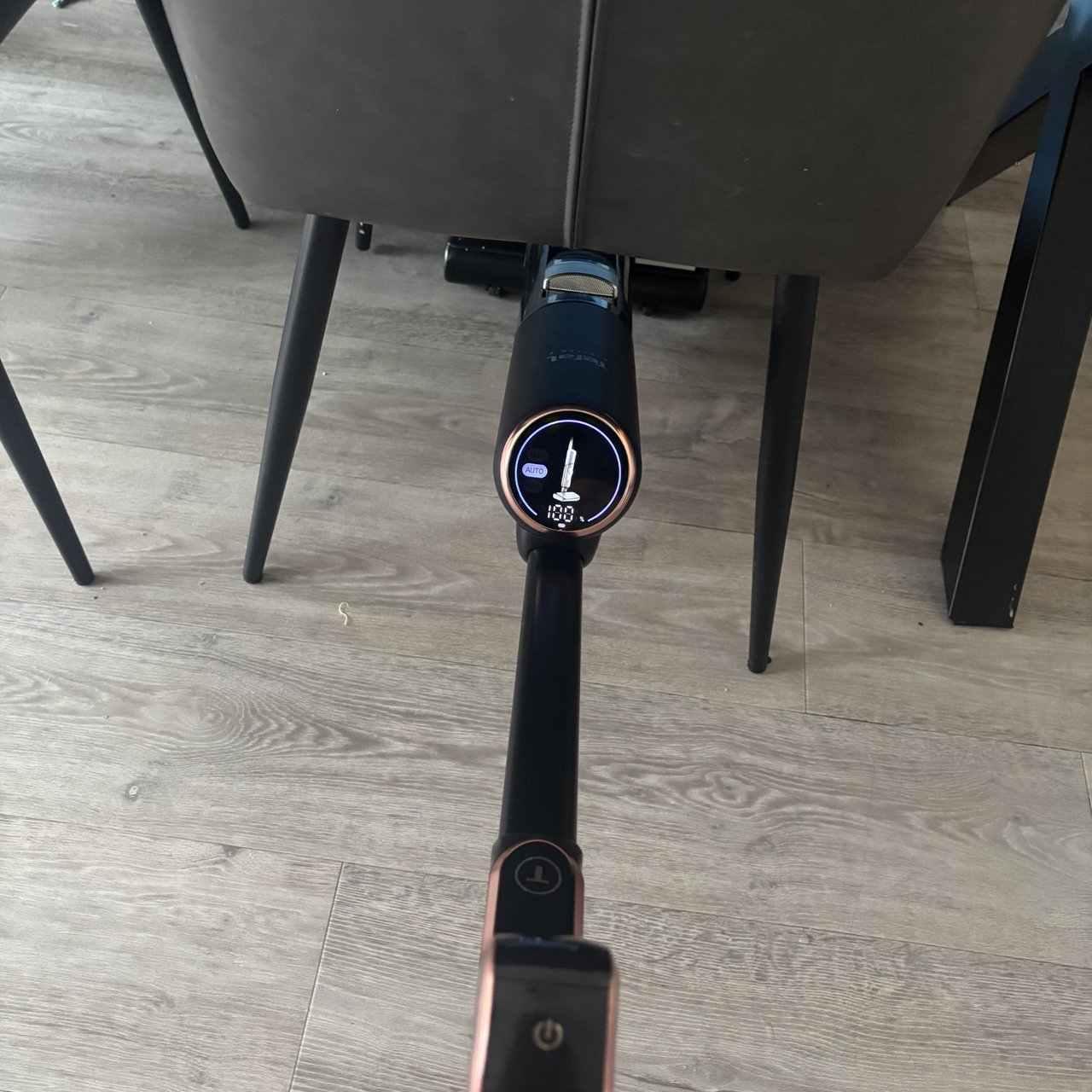 Tefal X-Clean 7 cleaning underneath chair and dining table
